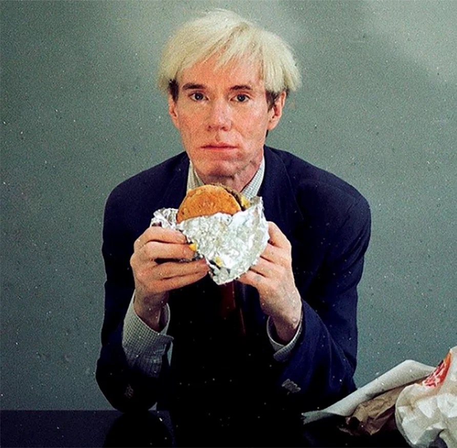 Andy Warhol eating a burger